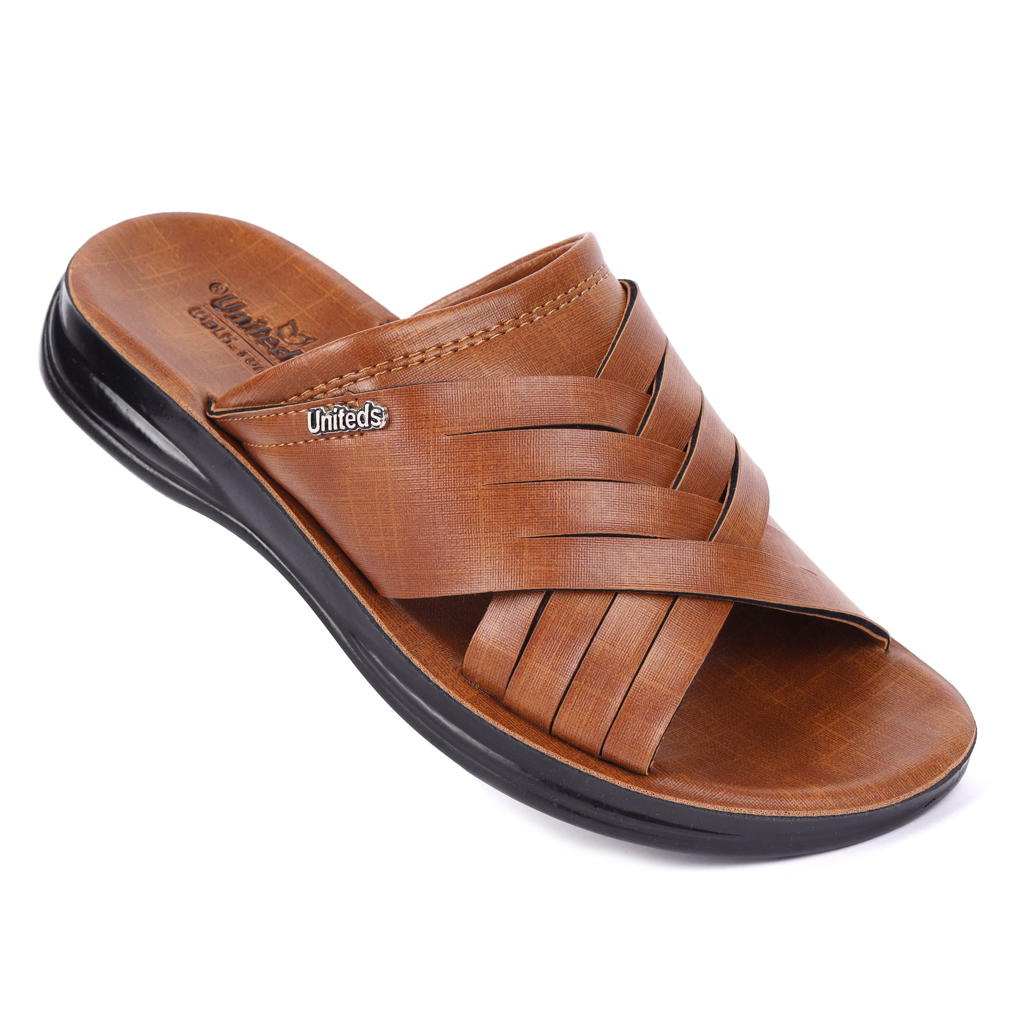 Tan sandal with criss-cross straps on a white background